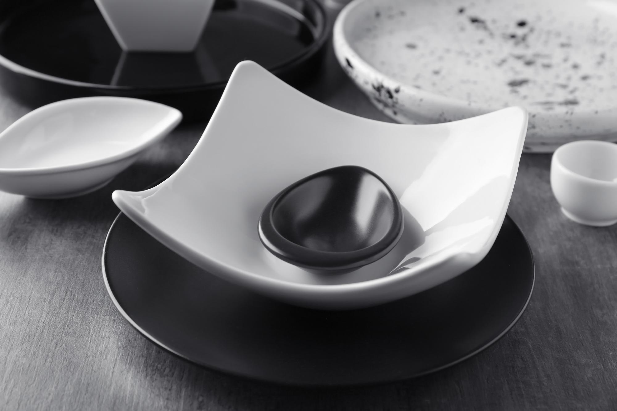 Close-up of plated modern culinary dish on metal tray
